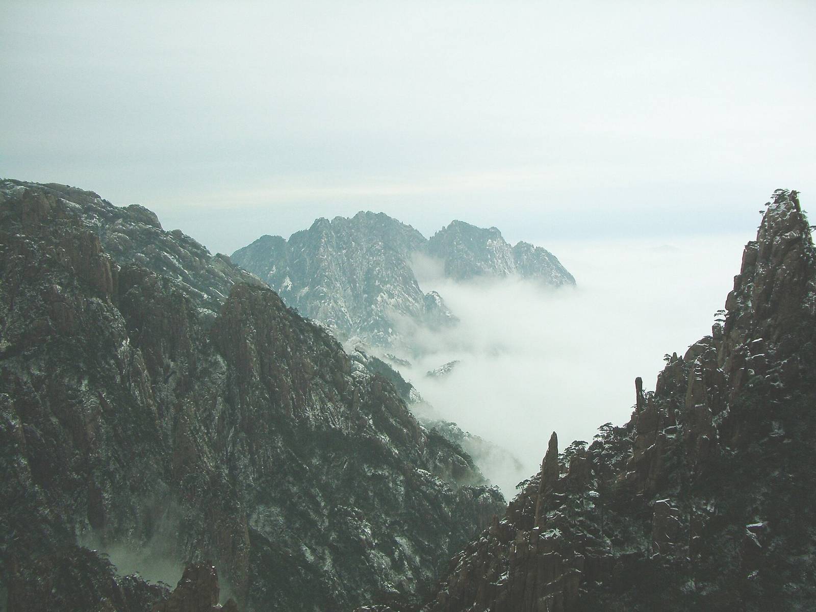 Granite peaks rising out of clouds at Huangshan